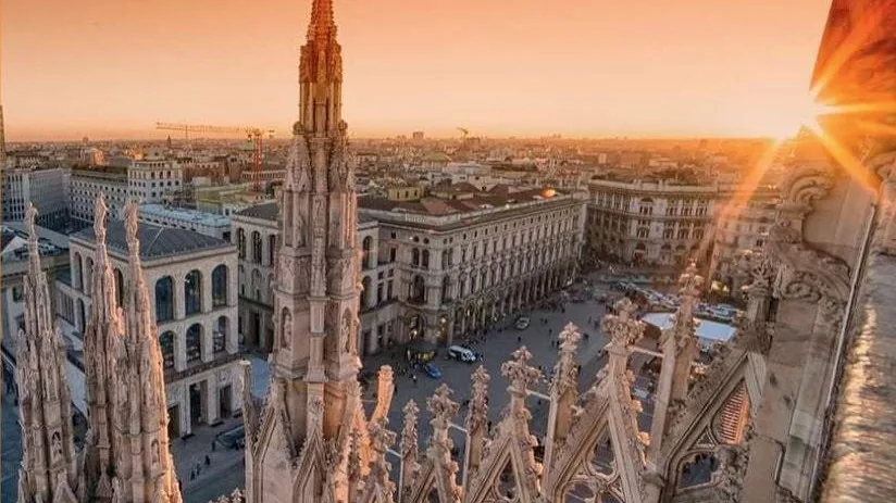 Milan from the roof of the Duomo at sunset, looking over the spires to Piazza del Duomo