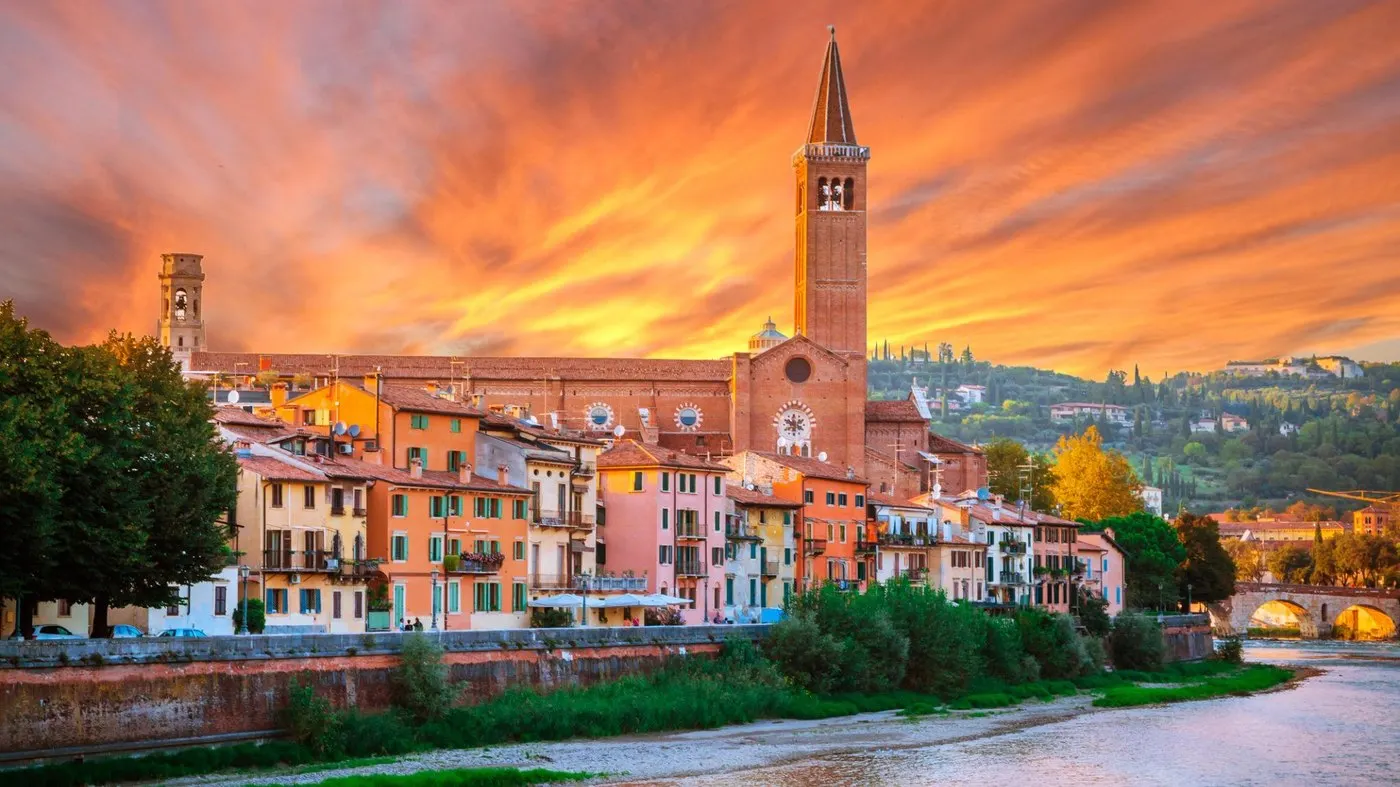 Verona at sunset: the Adige river, the bell towers and the coloured houses of the old city