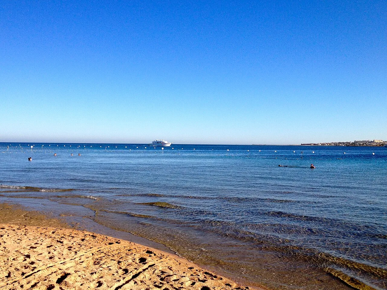 The shoreline at Makadi Bay on Egypt's Red Sea coast, with clear shallow water over sand and reef